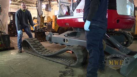 mini excavator with rubber tracks|installing track on mini excavator.